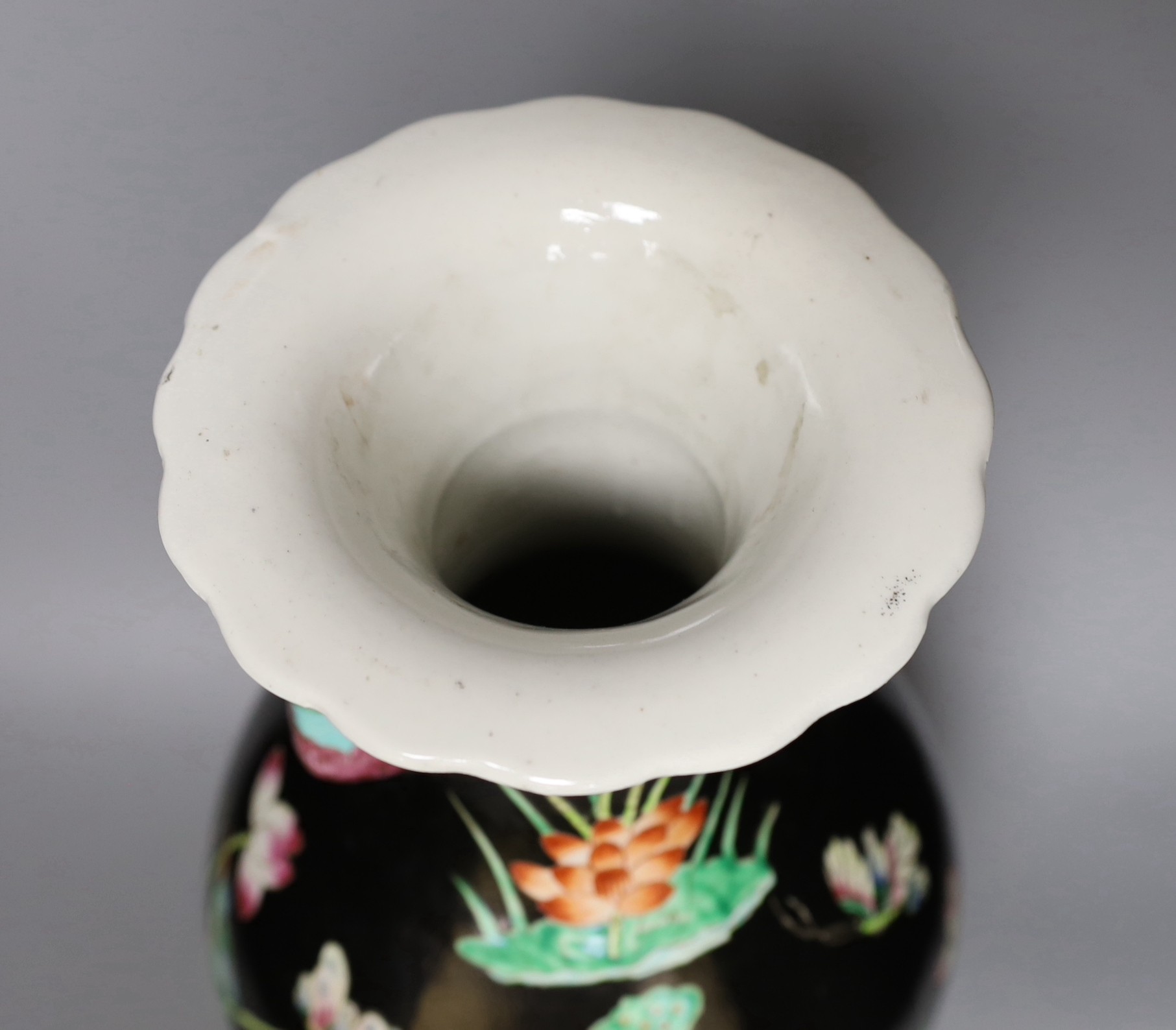 A Chinese famille noire vase, on plinth, 46 cms high